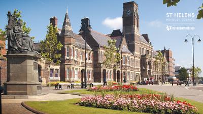 An image of St Helens Town Hall across Victoria Park