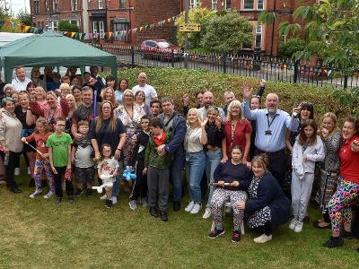 People attending a garden party at Abbeyford Children's Home