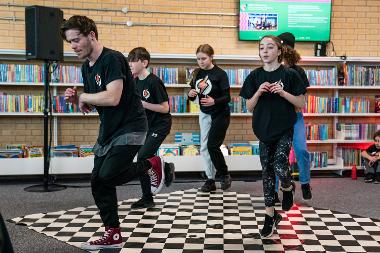 UC Crew performer breakdancing @ St Helens Library