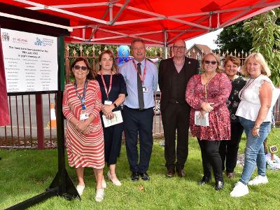 Councillor Marlene Quinn unveils the memorial at Kershaw Day Support Centre with senior leaders at St Helens Borough Council including Mark Palethorpe, Executive Director for People Services and Rachel Cleal, Director of Adult Social Care