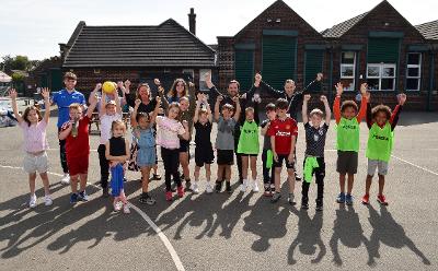 Children with Council leader David Baines and Councillor Nova Charlton celebrating the Ofsted inspection report