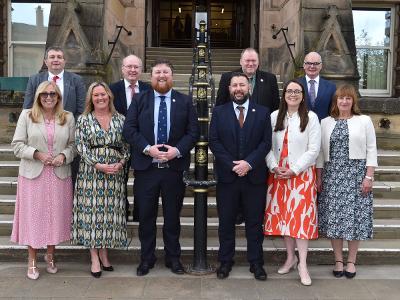 The new Cabinet at St Helens Borough Council on the town hall steps. Front row: Councillor Sue Murphy MBE, Councillor Nova Charlton, Councillor Seve Gomez-Aspron MBE, Councillor Anthony Burns, Councillor Kate Groucutt and Councillor Trish Long. Back row: 