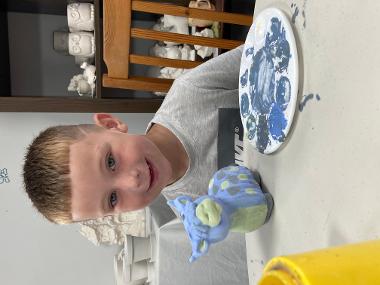 Children and young people enjoying Pottery Painting sessions