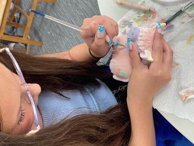 Children and young people enjoying Pottery Painting sessions