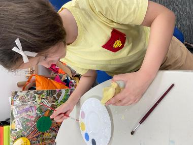 Children and young people enjoying Pottery Painting sessions